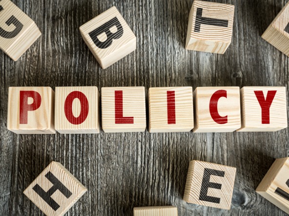 Word 'policy' spelled out in wooden blocks